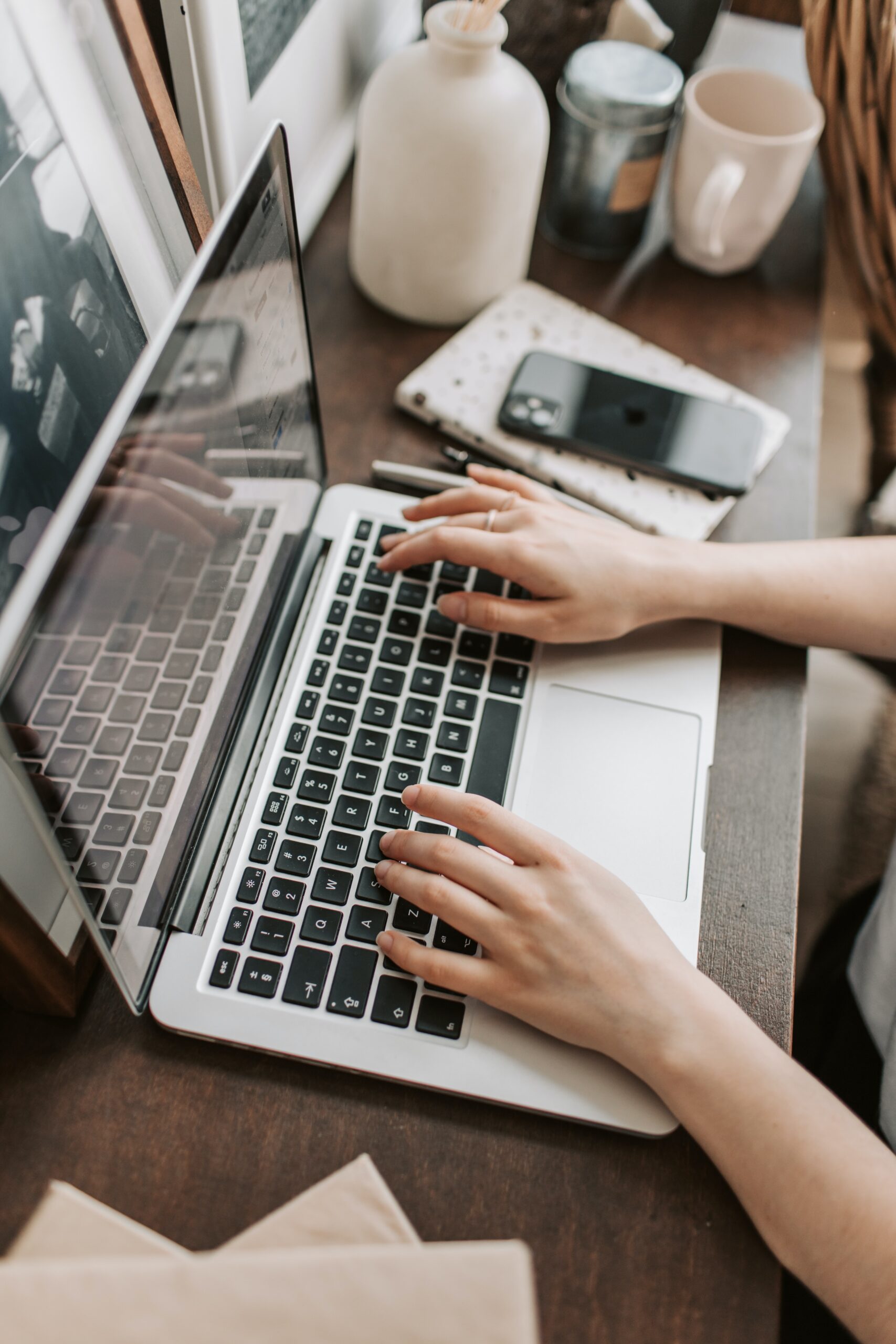 Woman w/ Laptop on desk